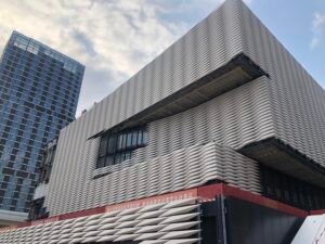 completed commercial building facade with white limestone cladding