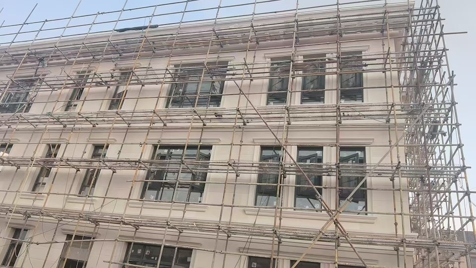 natural limestone facade cladding on modern building exterior