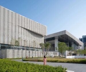 modern commercial building facade clad with beige limestone panels